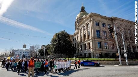 People walk past the Georgia State Capitol while participating in the Georgia March for Life &amp; Memorial Service &amp; Rally in downtown Atlanta, in January.