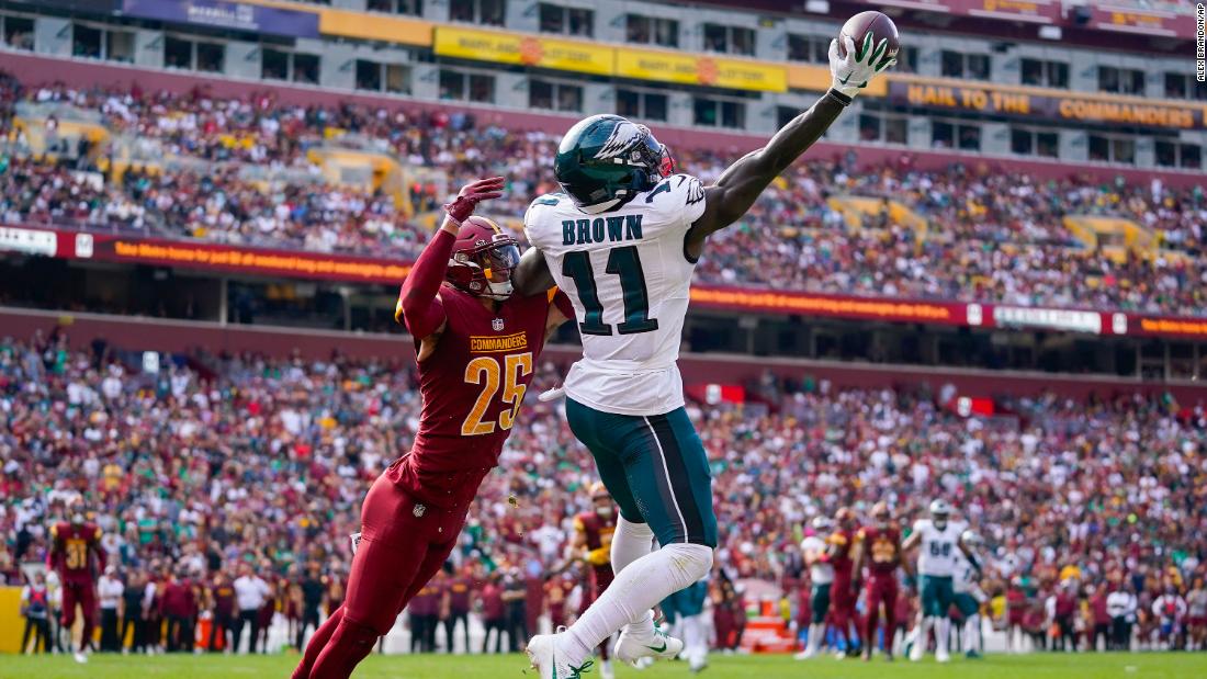 Philadelphia Eagles wide receiver A.J. Brown makes a one-handed catch to score a touchdown against Washington Commanders cornerback Benjamin St-Juste on October 29. The Eagles beat the Commanders 38-31.