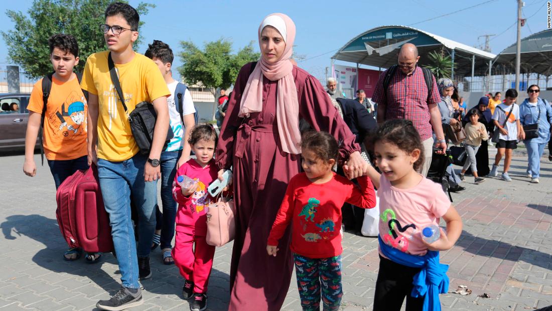 Palestinians move through the Rafah border crossing between Gaza and Egypt, on November 1. Injured Palestinians and foreign nationals from Gaza have &lt;a href=&quot;https://edition.cnn.com/2023/11/01/middleeast/rafah-border-crossing-egypt-foreign-nationals-gaza-intl-hnk/index.html&quot; target=&quot;_blank&quot;&gt;started crossing the border&lt;/a&gt; into Egypt, officials and Egyptian media said, in the first sanctioned exodus from the besieged enclave in weeks.