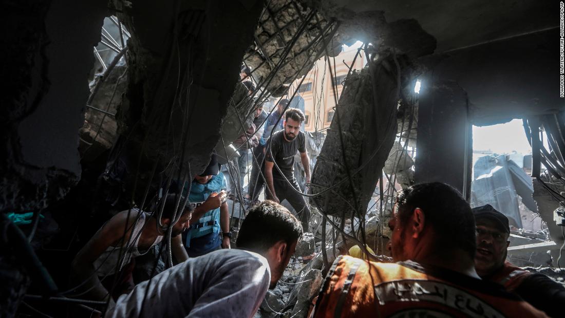 Palestinians search for survivors following an Israeli air strike in Khan Younis, Gaza on November 3. 