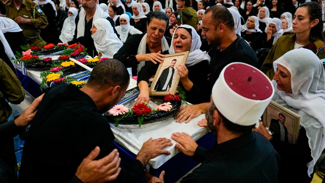 Mourners gather around the coffin of Druze Israeli Lieutenant colonel Salman Habaka in the village of Yanuh Jat, northern Israel, on November 3