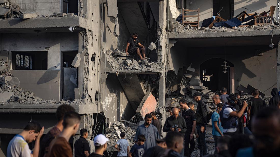 Palestinians look for survivors following an Israeli bombardment in the Al-Maghazi refugee camp, Gaza, on November 5.