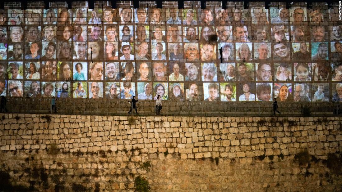 Photographs of Israeli hostages being held by Hamas militants are projected onto the walls of Jerusalem&#39;s Old City on November 6.