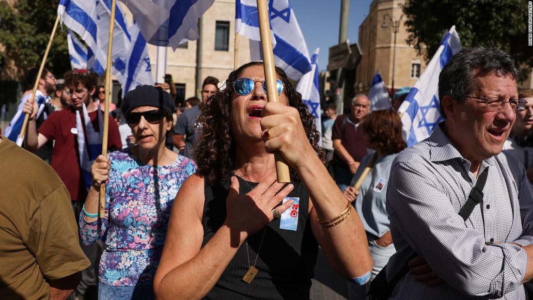 People hold Israeli flags in Jerusalem on November 7, one month after Hamas&#39;s attacks in Israel.