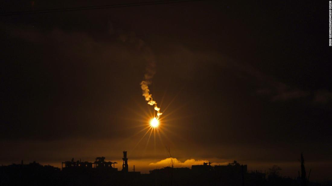 This picture taken from the Israeli side of the border with the Gaza Strip early on November 12, shows flares being fired by Israeli troops over the Gaza Strip.