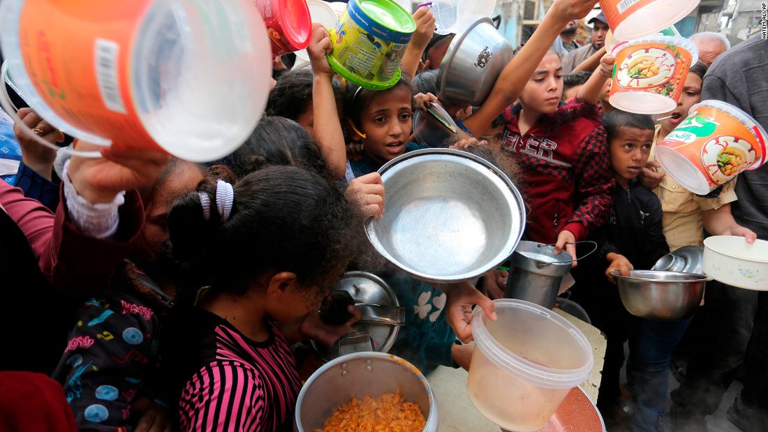 Palestinians line up for food in Rafah, Gaza, on November 13.