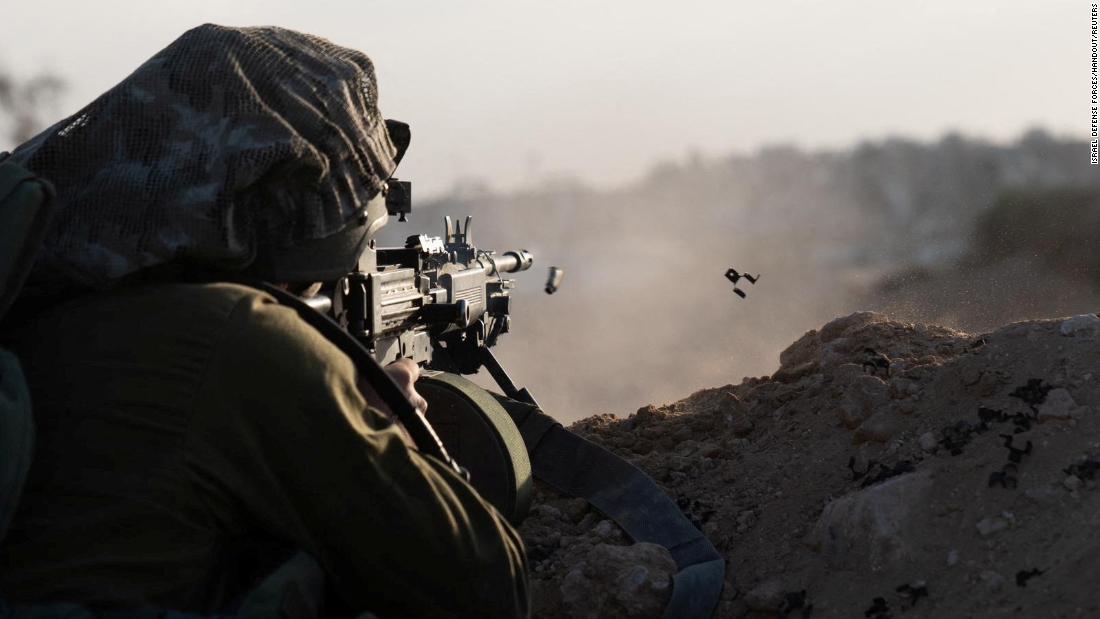 An Israeli soldier fires his weapon in Gaza on November 13.
