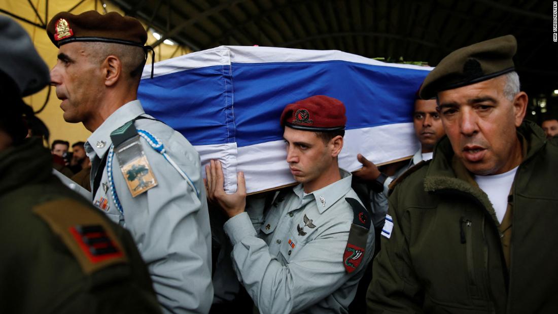 Israeli soldiers carry the casket of Major Jamal Abbas, an Israeli soldier from Israel&#39;s Druze minority who was killed in Gaza amid Israel&#39;s ongoing ground operation, at his funeral in Pekiin, Israel, on November 19.