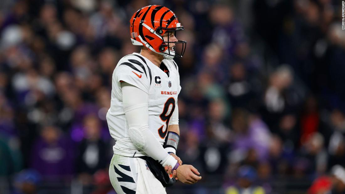 Cincinnati Bengals quarterback Joe Burrow holds his wrist after a throw during the Bengals&#39; 34-20 Thursday Night Football loss to the Baltimore Ravens on November 16. He tore a ligament in his right wrist.