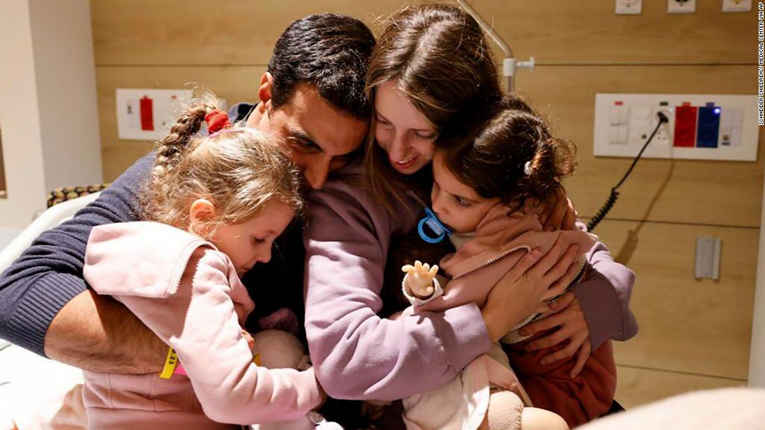 Members of the Asher family embrace each at Schneider Children&#39;s Medical Center in Petah Tikva, Israel on Friday, November 24. Sisters Aviv and Raz and their mother, Doron, were released on the first day of the truce between Israel and Hamas.