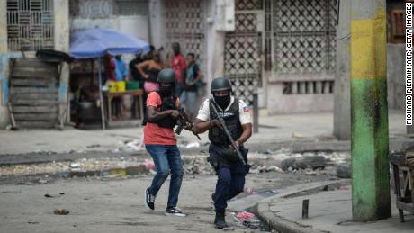 Police officers patrol a neighborhood amid gang-related violence in downtown Port-au-Prince on April 25, 2023. - Between April 14 and 19, clashes between rival gangs left nearly 70 people dead, including 18 women and at least two children, according to a United Nations statement released April 24. (Photo by RICHARD PIERRIN / AFP) (Photo by RICHARD PIERRIN/AFP via Getty Images)