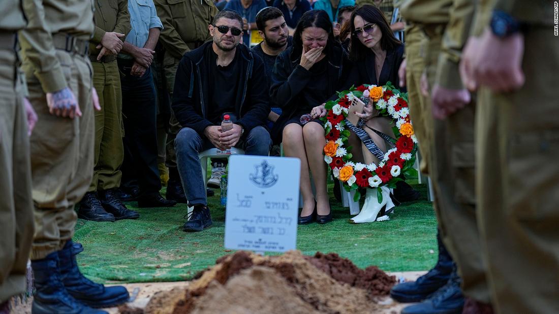 Viktor and Helena Brodski mourn during a memorial service for their son, Sgt. Kiril Brodski at the Kiryat Shaul military cemetery in Tel Aviv, Israel, on November 29.