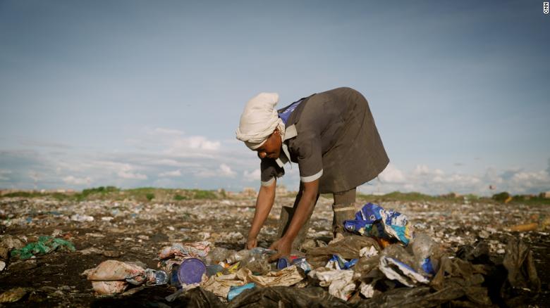 A woman scavenges through piles of garbage at Dandora in Nairobi, one of the largest dumpsites in the world.