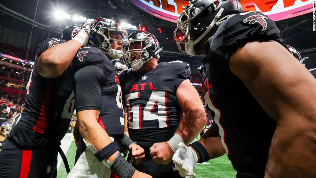 Atlanta Falcons quarterback Desmond Ridder celebrates with teammates after scoring a touchdown on December 10. The Falcons lost 29-25 to the Tampa Bay Buccaneers.
