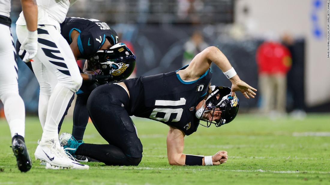 Jacksonville Jaguars quarterback Trevor Lawrence reacts after suffering an injury during the Jaguars&#39; 34-31 loss to the Cincinnati Bengals on Monday, December 4.