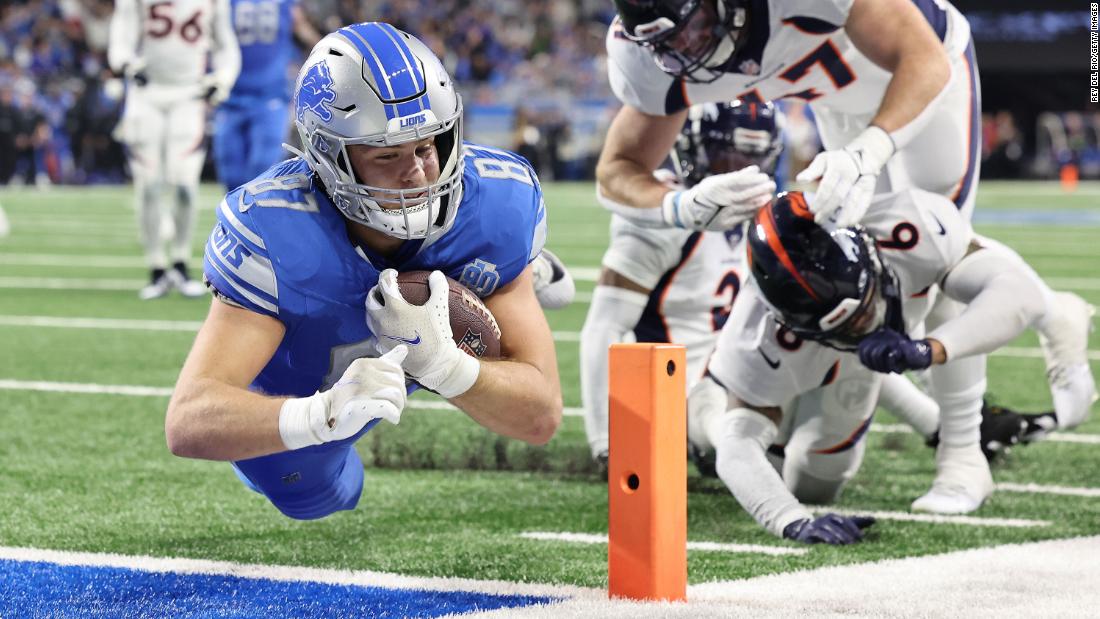 Detroit Lions tight end Sam LaPorta dives into the end zone for a touchdown on Saturday, December 16. The Lions beat the Denver Broncos 42-17.