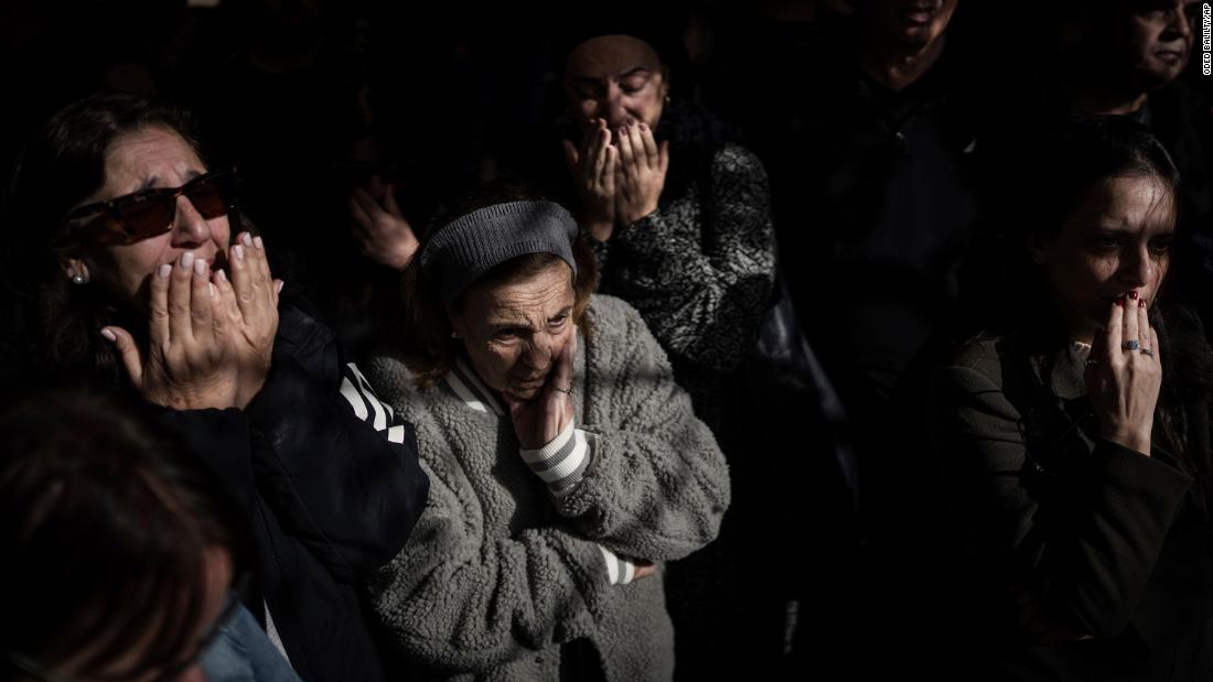 Mourners at the grave of Lt. Yaacov Elian mourn during his funeral at Kiryat Shaul cemetery in Tel Aviv, Israel, on December 22.