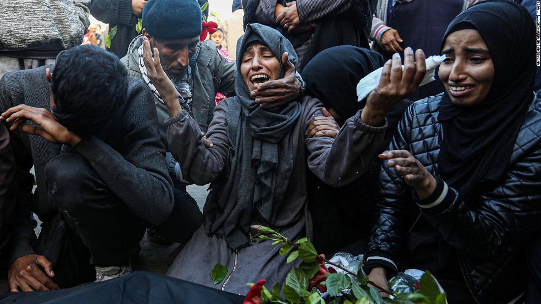 Mourners collect the bodies of Palestinians killed in an Israeli airstrike in Khan Younis, Gaza, on December 24.