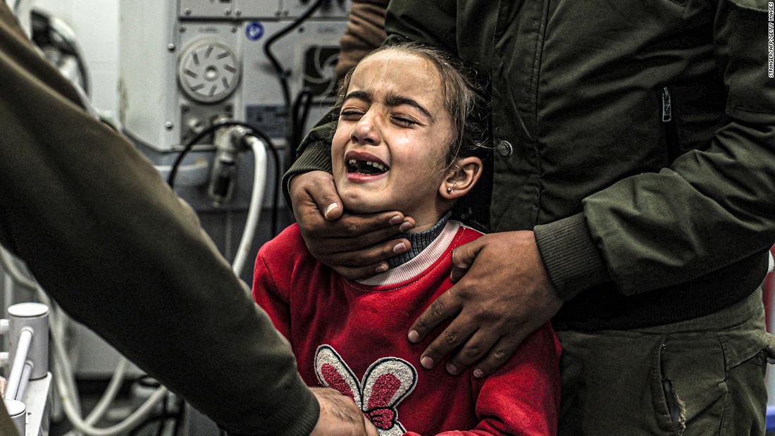 A girl mourns the death of her relatives who were killed by Israeli bombardment, at the European Hospital in Khan Yunis in the southern Gaza Strip on December 31.