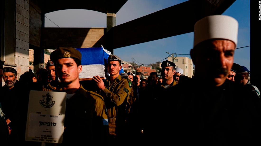 Israeli soldiers carry the flag-draped casket of Staff Sgt. Sufian Dagash during his funeral in the village of Maghar, northern Israel, on January 3.
