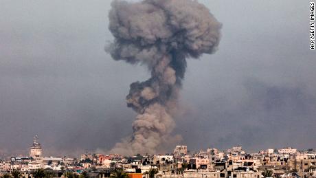 TOPSHOT - A smoke plume erupts over Khan Yunis from Rafah in the southern Gaza strip during Israeli bombardment on January 8, 2024 amid the ongoing conflict between Israel and the Palestinian Hamas militant group. (Photo by AFP) (Photo by -/AFP via Getty Images)
