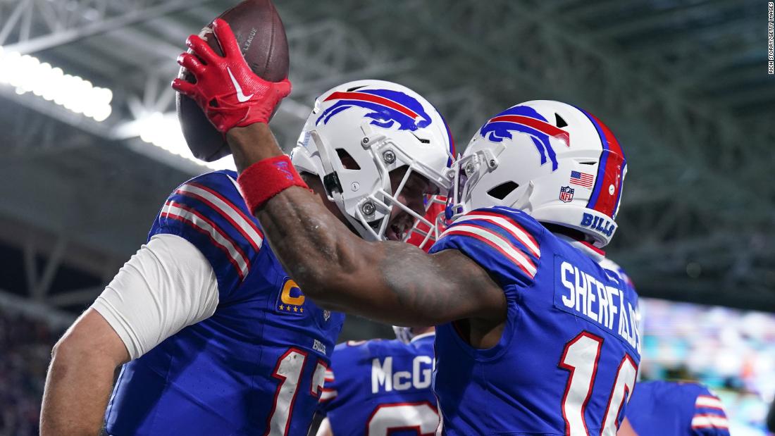 Buffalo Bills quarterback Josh Allen and wide receiver Trent Sherfield celebrate after a touchdown against the Miami Dolphins on Sunday, January 7. The Bills defeated the Dolphins 21-14 to win the AFC East title and clinch a home playoff game next week. The Dolphins — in first place for much of the season — had to settle for a wild-card spot.