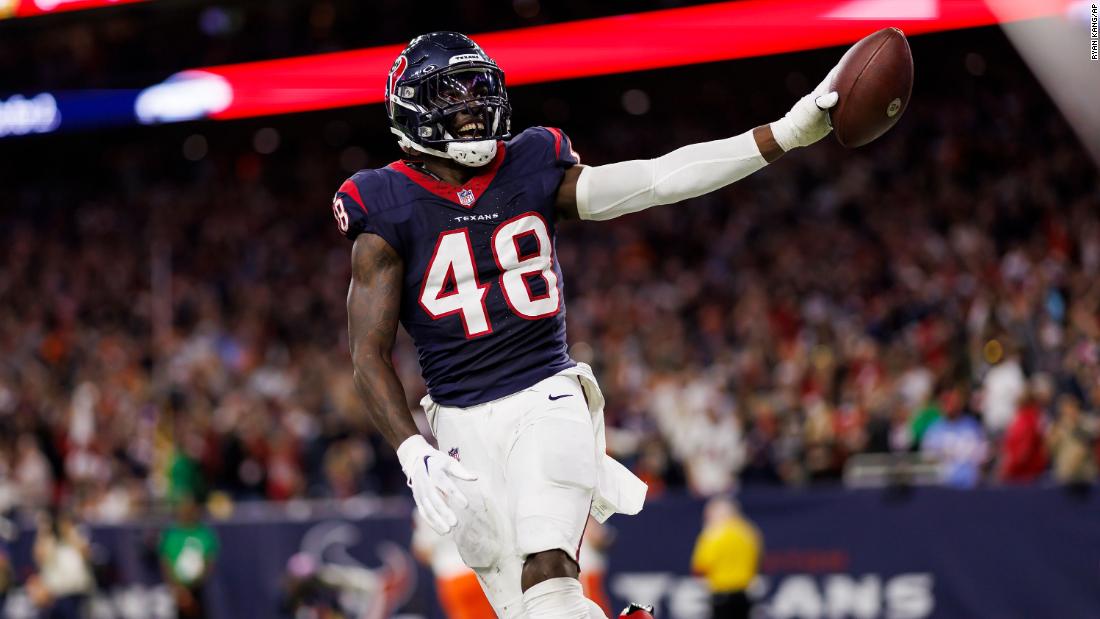 Houston Texans linebacker Christian Harris celebrates after returning an interception for a touchdown against the Cleveland Browns on January 13. The Texans returned two interceptions for touchdowns as they defeated the Browns 45-14.