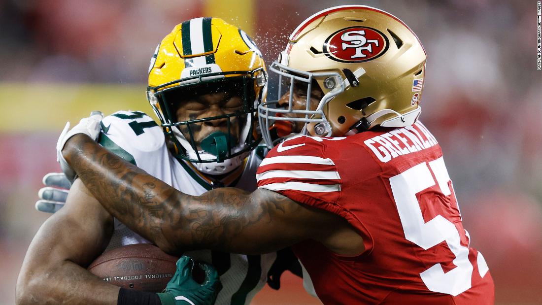 San Francisco 49ers linebacker Dre Greenlaw tackles Green Bay Packers running back Emanuel Wilson on Saturday, January 20, at Levi&#39;s Stadium in Santa Clara, California. The 49ers won 24-21 and will move on to the NFC Championship game.