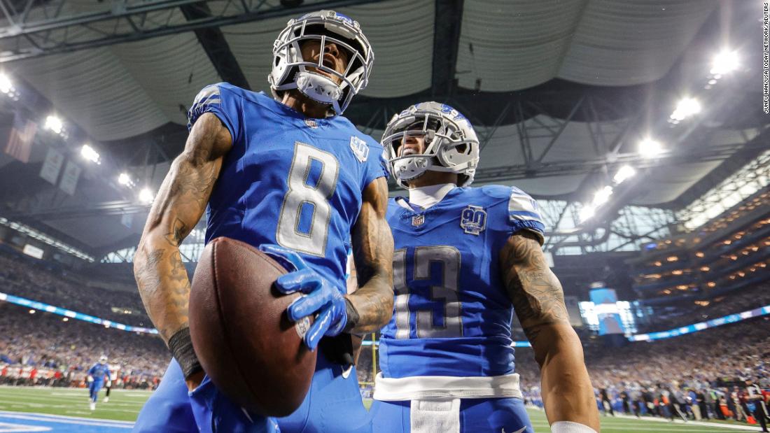Detroit Lions wide receiver Josh Reynolds, left, celebrates a touchdown with running back Craig Reynolds during the Lions&#39; game against the Tampa Bay Buccaneers on Sunday, January 21, at Ford Field in Detroit. The Lions won 31-23.