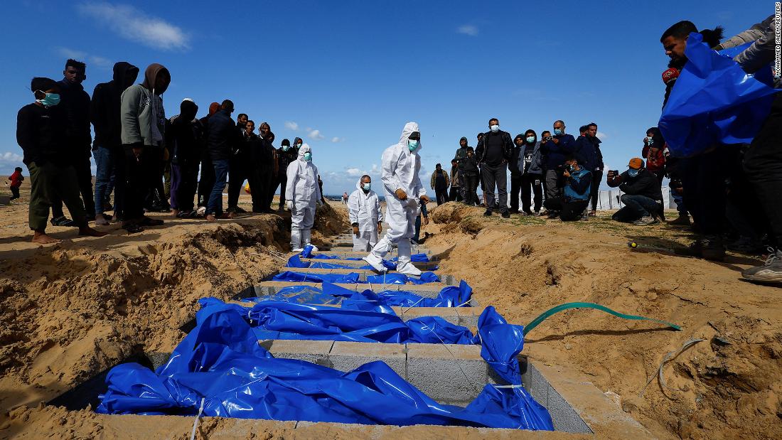 The bodies of Palestinians killed during the war are buried in a mass grave on January 30, in Rafah, Gaza. 