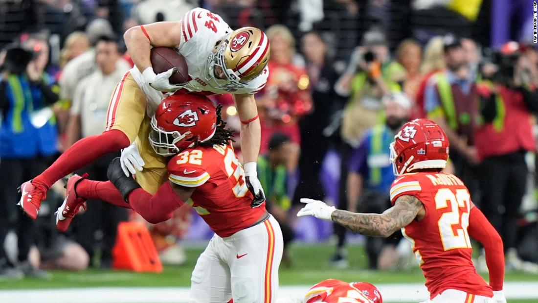 Chiefs linebacker Nick Bolton hits 49ers fullback Kyle Juszczyk on an early play.