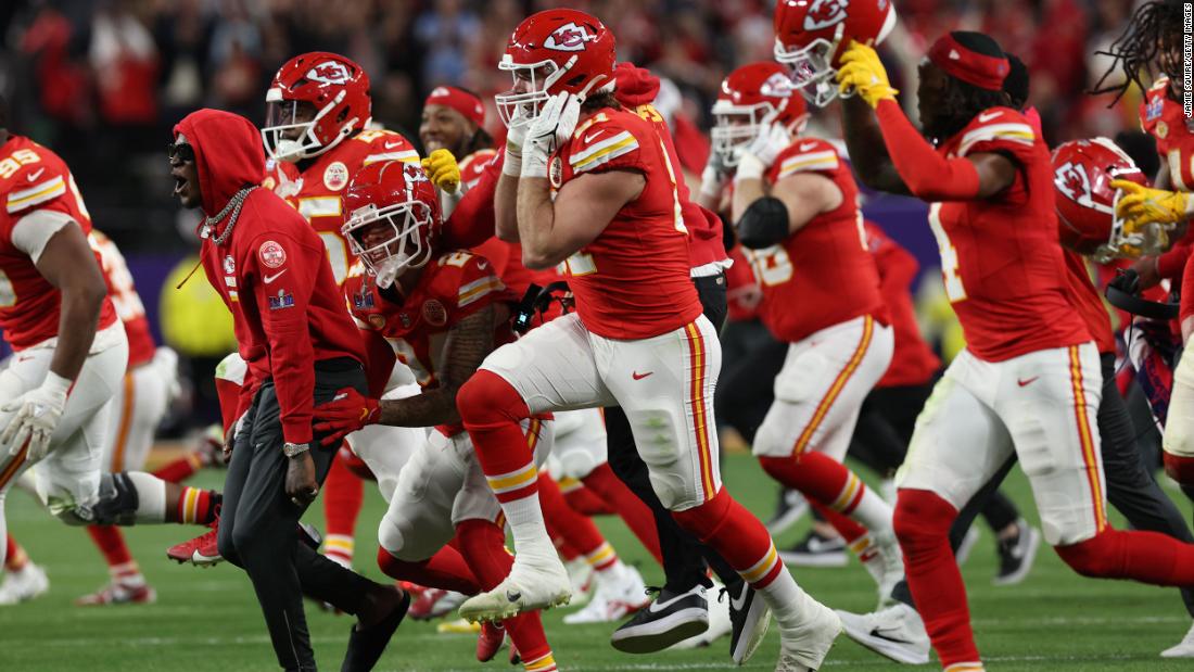 Chiefs players run onto the field after the game-winning touchdown.