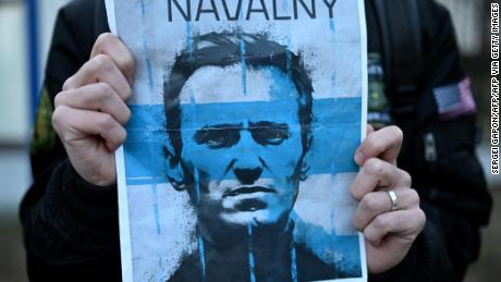 A demonstrator carries a placard with a picture of late Russian opposition leader Alexei Navalny as people gather to attend a rally in front of the Russian Embassy in Warsaw on February 16, 2024, following the announcement that the Kremlin&#39;s most prominent critic Alexei Navalny had died in an Arctic prison. Russian opposition leader Navalny died on February 16 at the Arctic prison colony in Russia&#39;s Yamalo-Nenets region in northern Siberia where he was serving a 19-year-term. Russian authorities announced Navalny&#39;s death a month before an election poised to extend Russian President Putin&#39;s hold on power. (Photo by Sergei GAPON / AFP) (Photo by SERGEI GAPON/AFP via Getty Images)