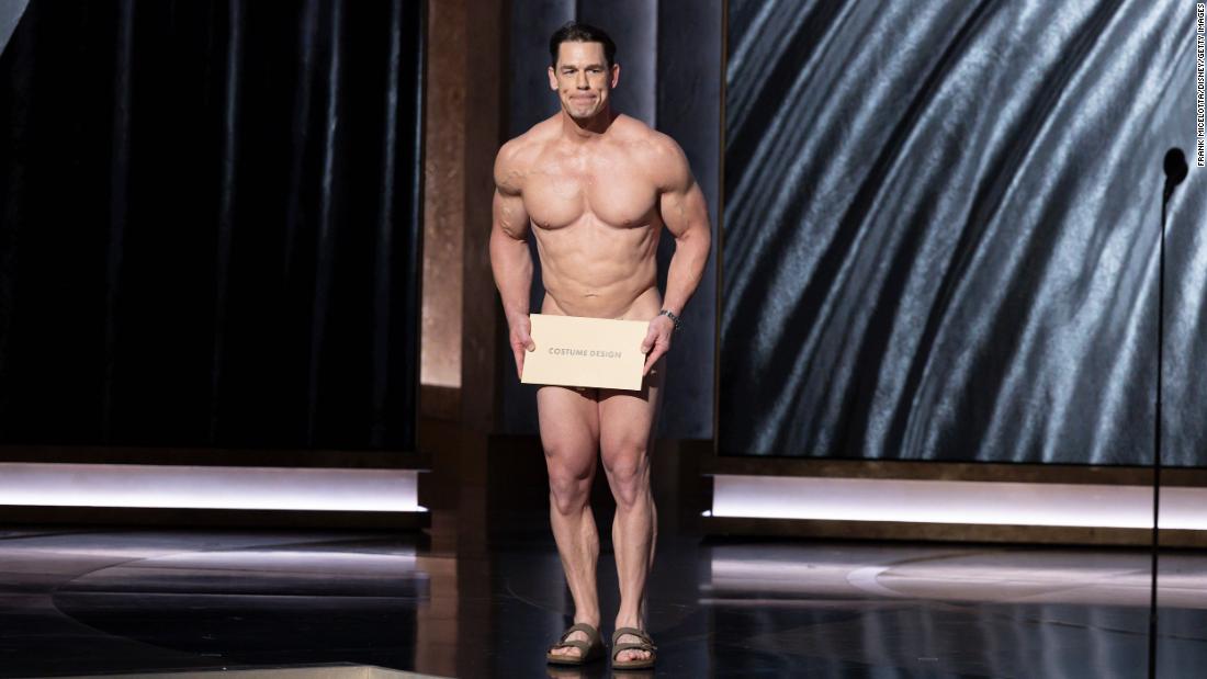 Cena presents the Oscar for best costume design. &lt;a href=&quot;https://www.cnn.com/entertainment/live-news/oscars-academy-awards-03-10-24/h_839d82945edb96c8ca36efd588094968&quot; target=&quot;_blank&quot;&gt;During the bit&lt;/a&gt;, show host Jimmy Kimmel coaxed Cena out on stage after Cena had second thoughts about streaking across stage. &quot;Costumes are so important,&quot; Cena joked before presenting the Oscar to Waddington and &quot;Poor Things.&quot;