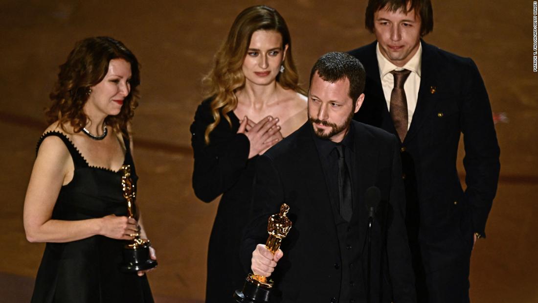 Ukrainian director Mstyslav Chernov accepts the Oscar for best documentary feature film (&quot;20 Days in Mariupol&quot;). &quot;Probably I will be the first director on this stage who will say, &#39;I wish I never made this film,&#39; &quot; &lt;a href=&quot;https://www.cnn.com/entertainment/live-news/oscars-academy-awards-03-10-24#h_a51bb9d9b0663c1bafad749b433b97d8&quot; target=&quot;_blank&quot;&gt;Chernov said&lt;/a&gt;. &quot;I wish to be able to exchange this (for) Russia never attacking Ukraine, never occupying our cities.&quot;