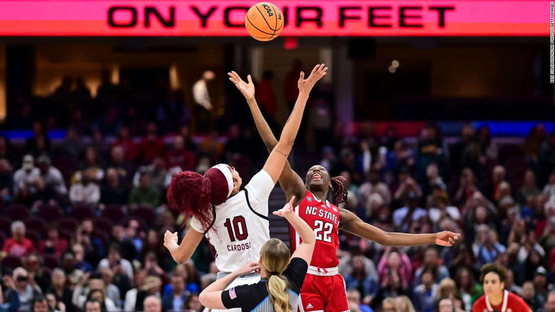 Kamilla Cardoso of the South Carolina Gamecocks and Saniya Rivers jump for the opening tipoff.