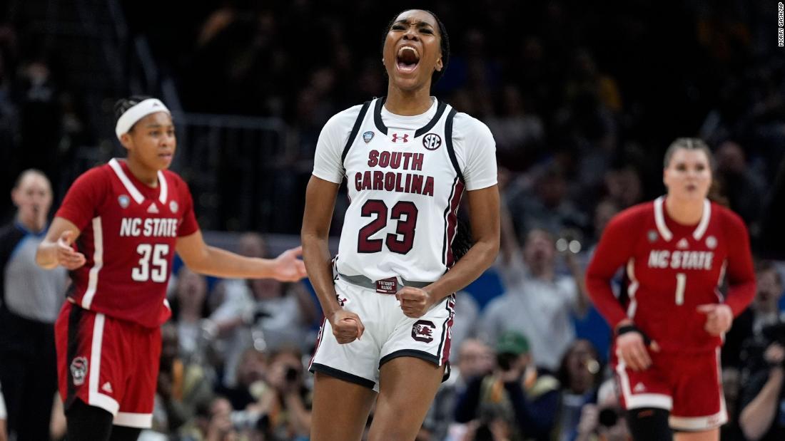 Hall celebrates after making a three-point basket during the second half.