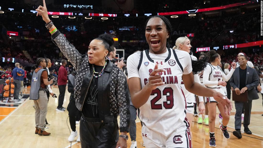 South Carolina coach Dawn Staley and guard Bree Hall celebrate after defeating the NC State Wolfpack 78-59 in the Final Four of the women&#39;s tournament