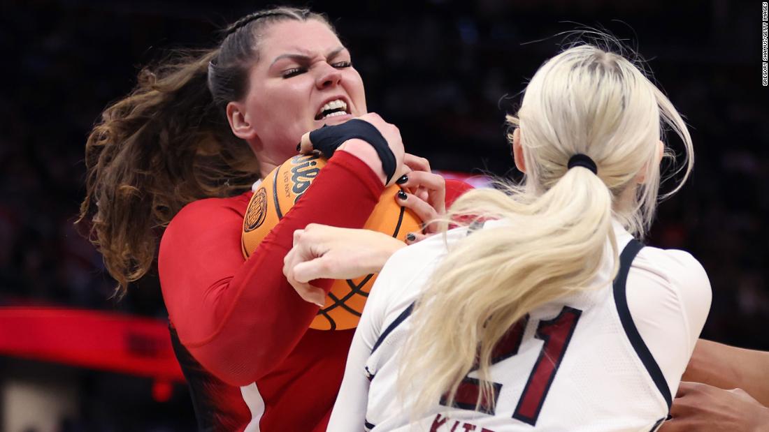 NC State&#39;s River Baldwin fights Chloe Kitts of South Carolina for possession of the ball in the second half.