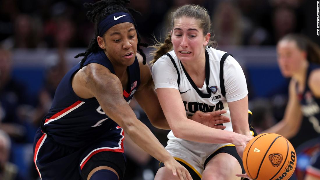 Martin and Arnold #2 of the UConn Huskies fight for the ball.