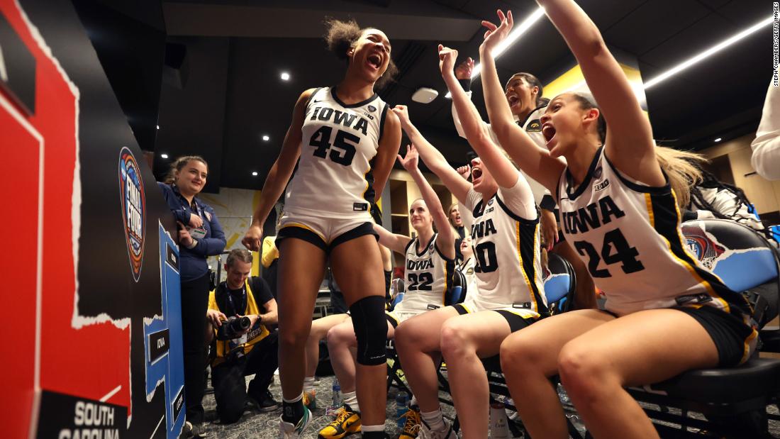 The Iowa Hawkeyes celebrate after beating the UConn Huskies 71-69 in a Final Four semifinal game at Rocket Mortgage Fieldhouse on Friday, April 5, in Cleveland. 