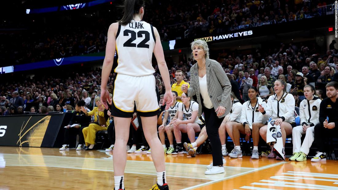 Clark listens to Iowa coach Lisa Bluder during the second half.