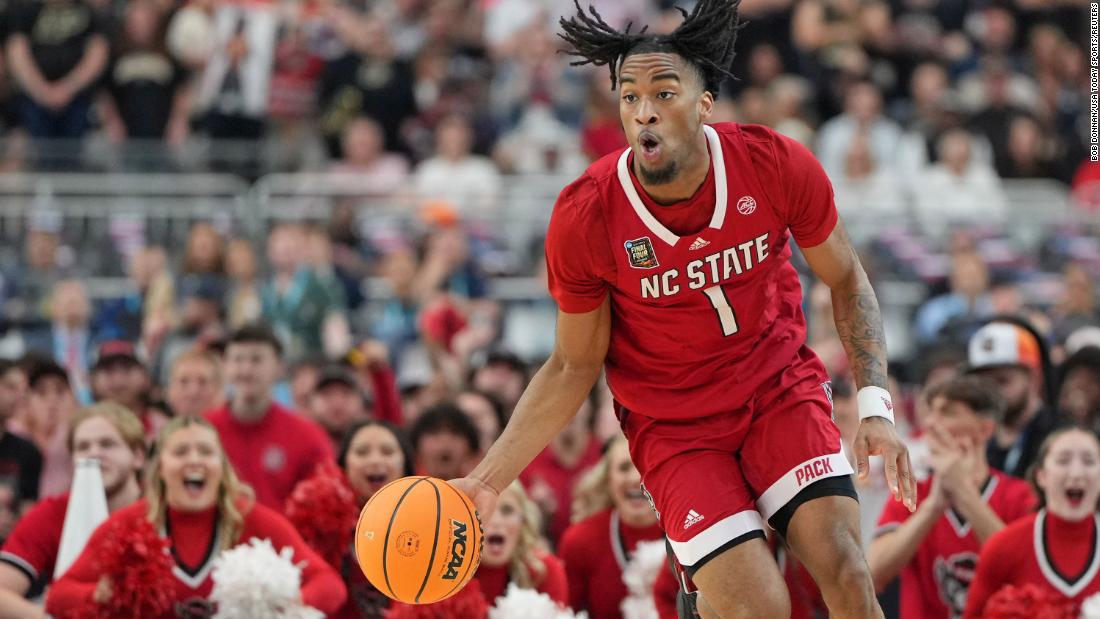 Wolfpack guard Jayden Taylor dibbles the ball. 