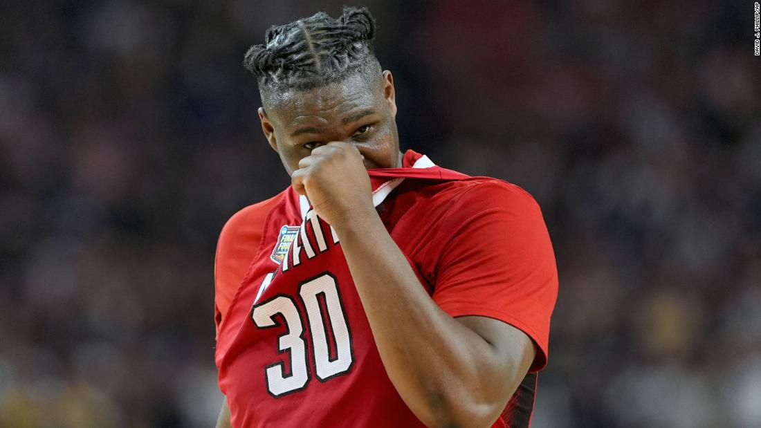 NC State forward DJ Burns Jr. walks off the court after losing to Purdue.