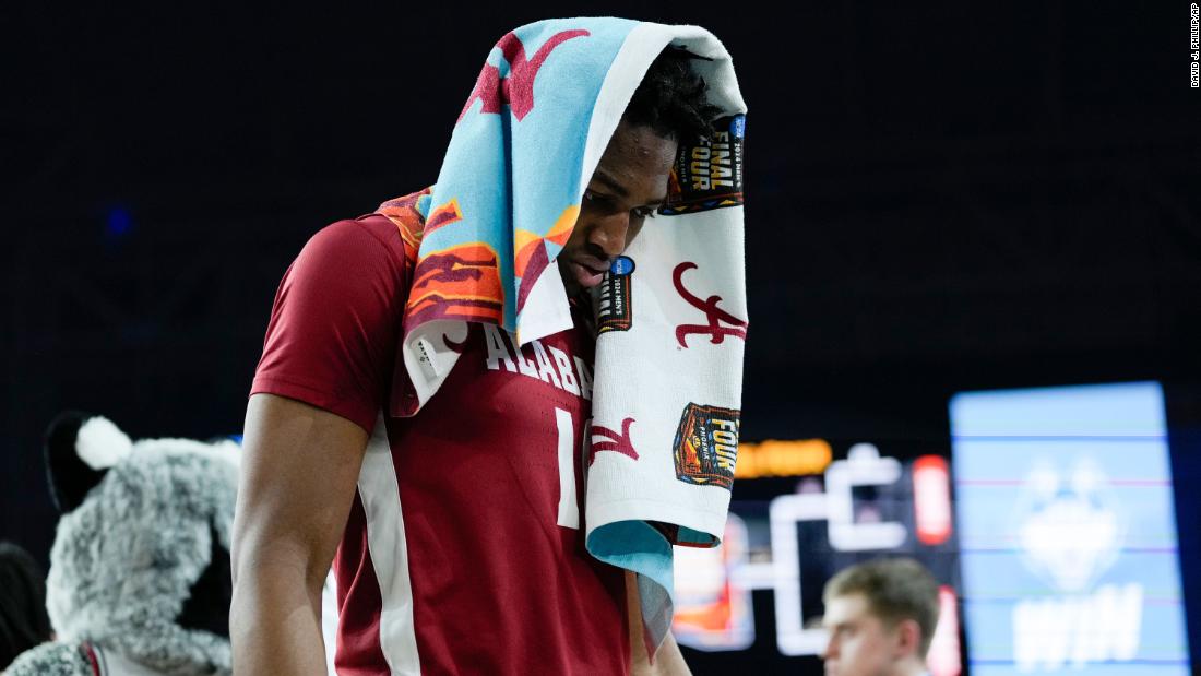 Alabama forward Mouhamed Dioubate walks off the court after losing to UConn.