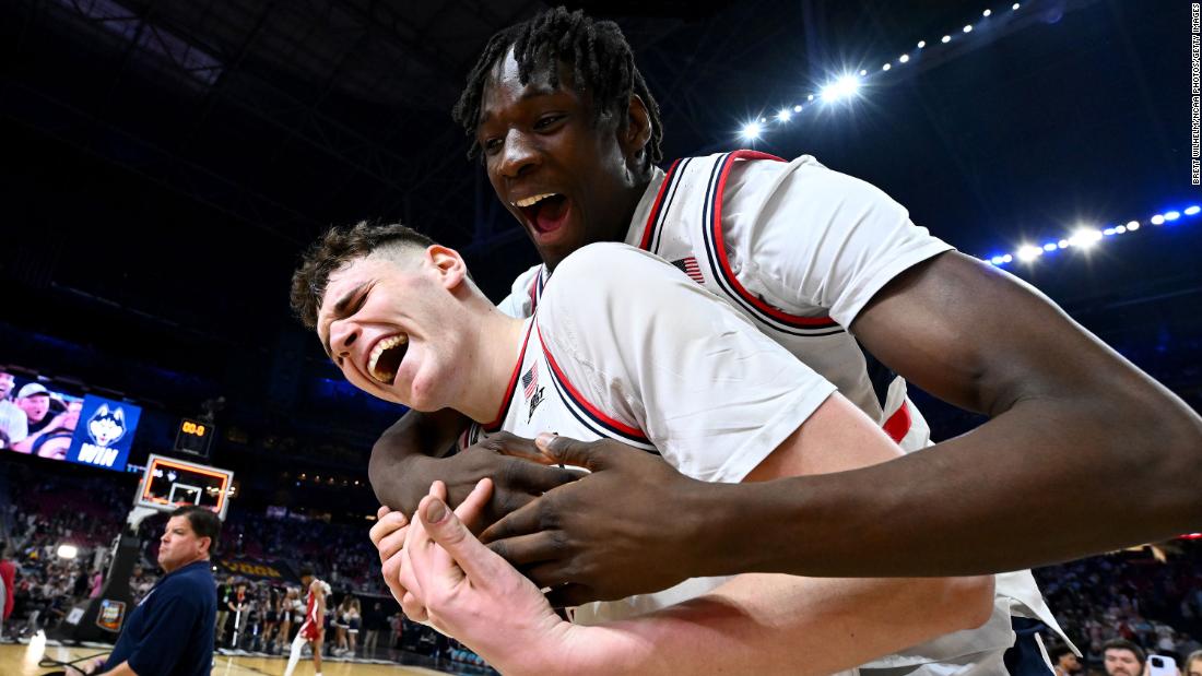 UConn&#39;s Donovan Clingan and Youssouf Singare celebrate their 86-72 victory over Alabama in the Final Four game on Saturday.