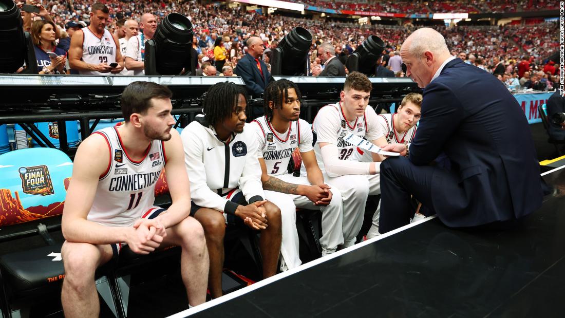 Hurley talks to the team during player introductions before the game.