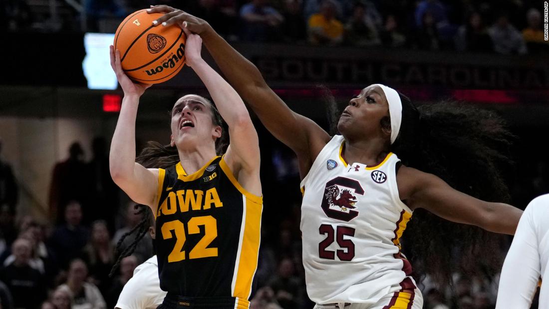 South Carolina guard Raven Johnson blocks a shot by Clark.