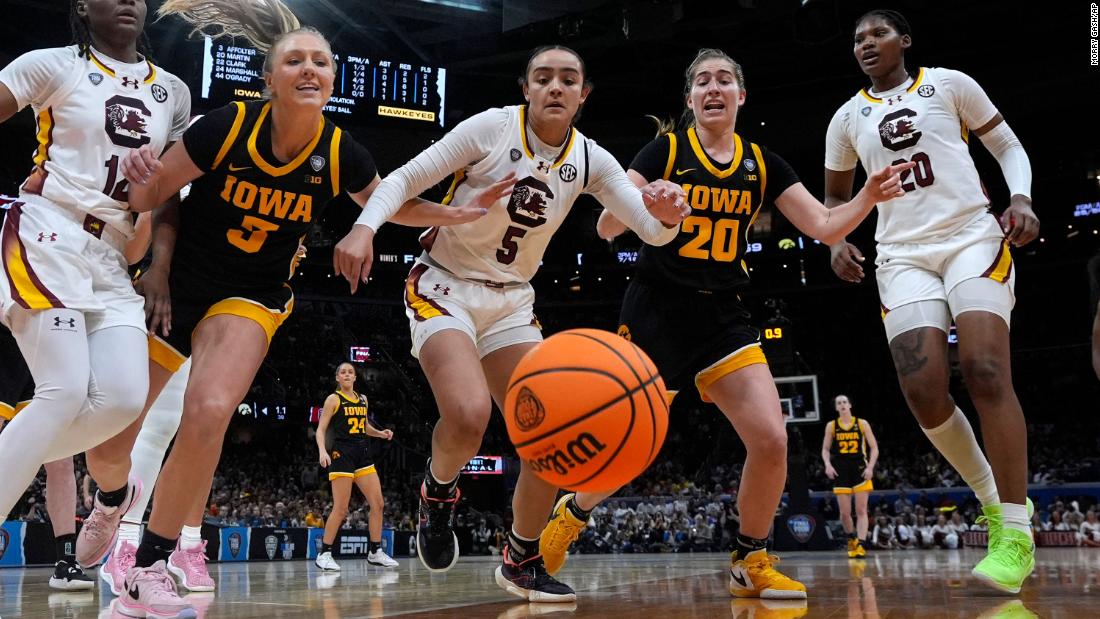 South Carolina and Iowa players go after a loose ball.