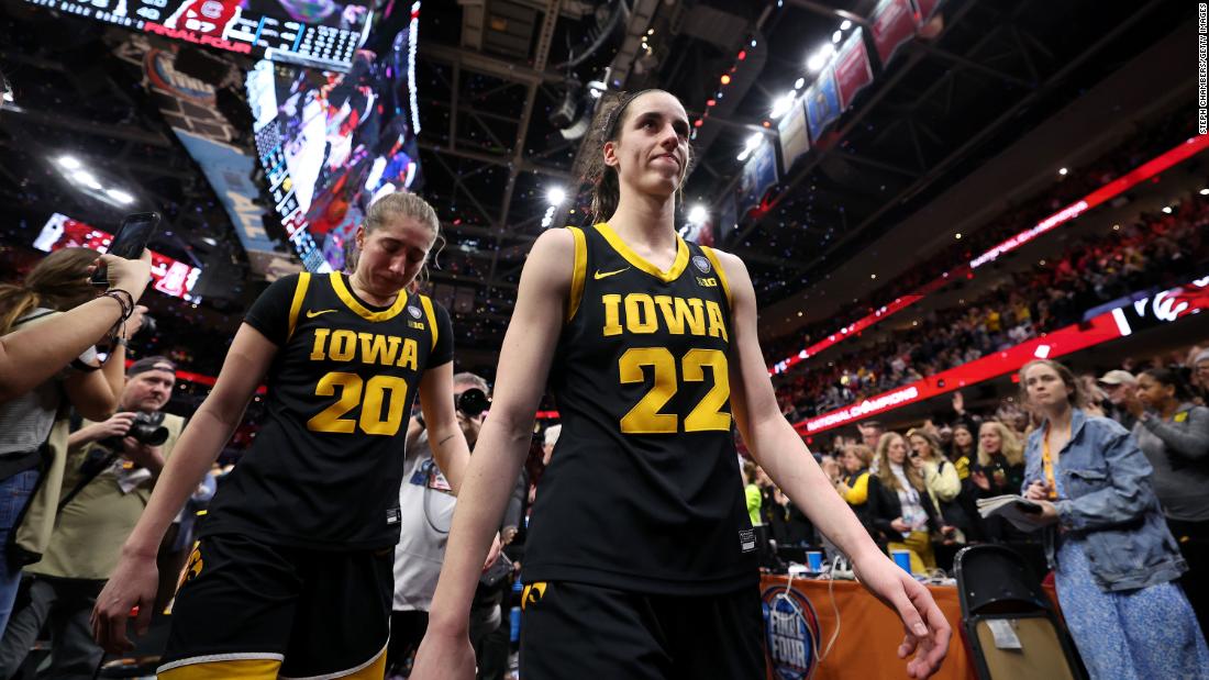 Clark, right, and Kate Martin walk off the court after losing to South Carolina.